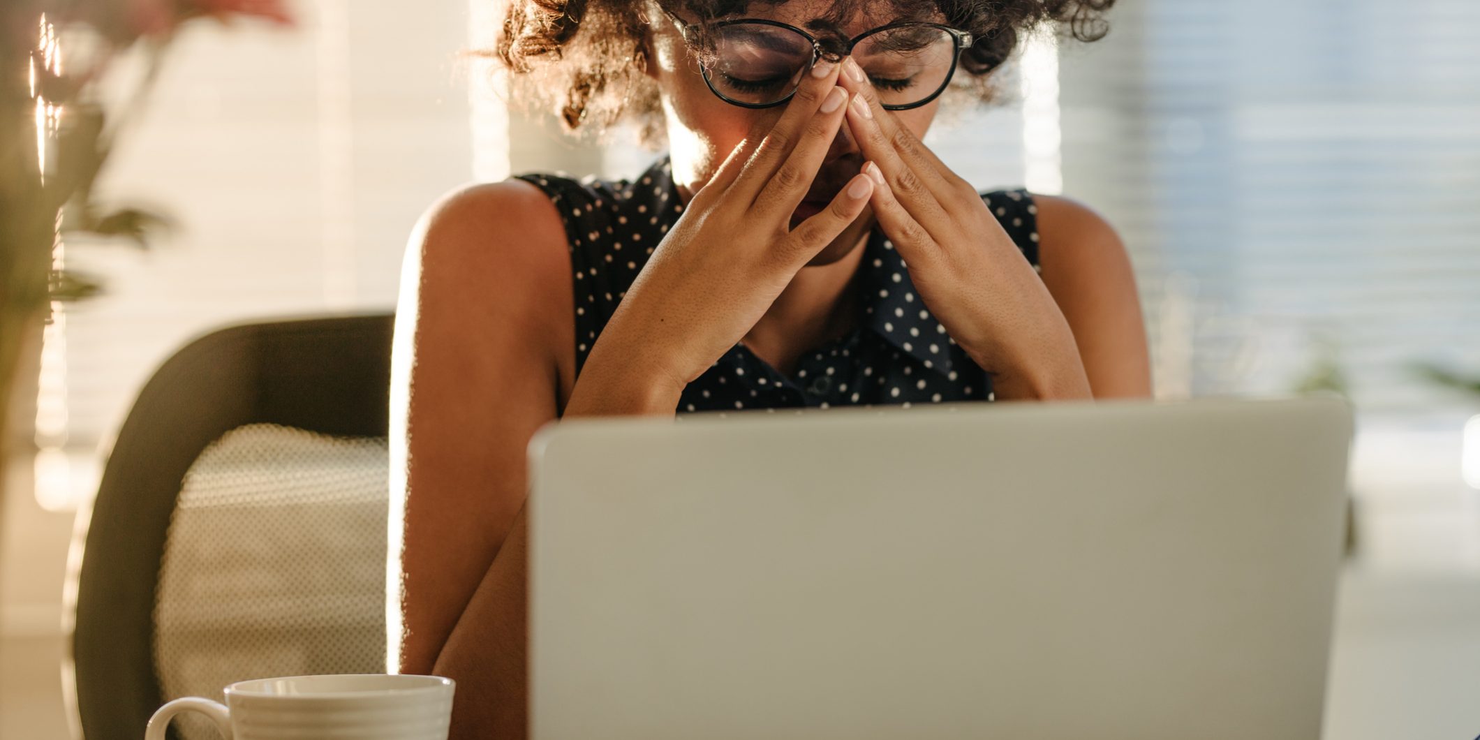 Stressed businesswoman sitting at desk